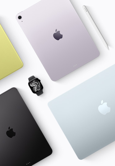 中央にあるブラックのApple Watchの周りに、様々なカラーのMacとiPadが並んでいる様子を上から見たところ